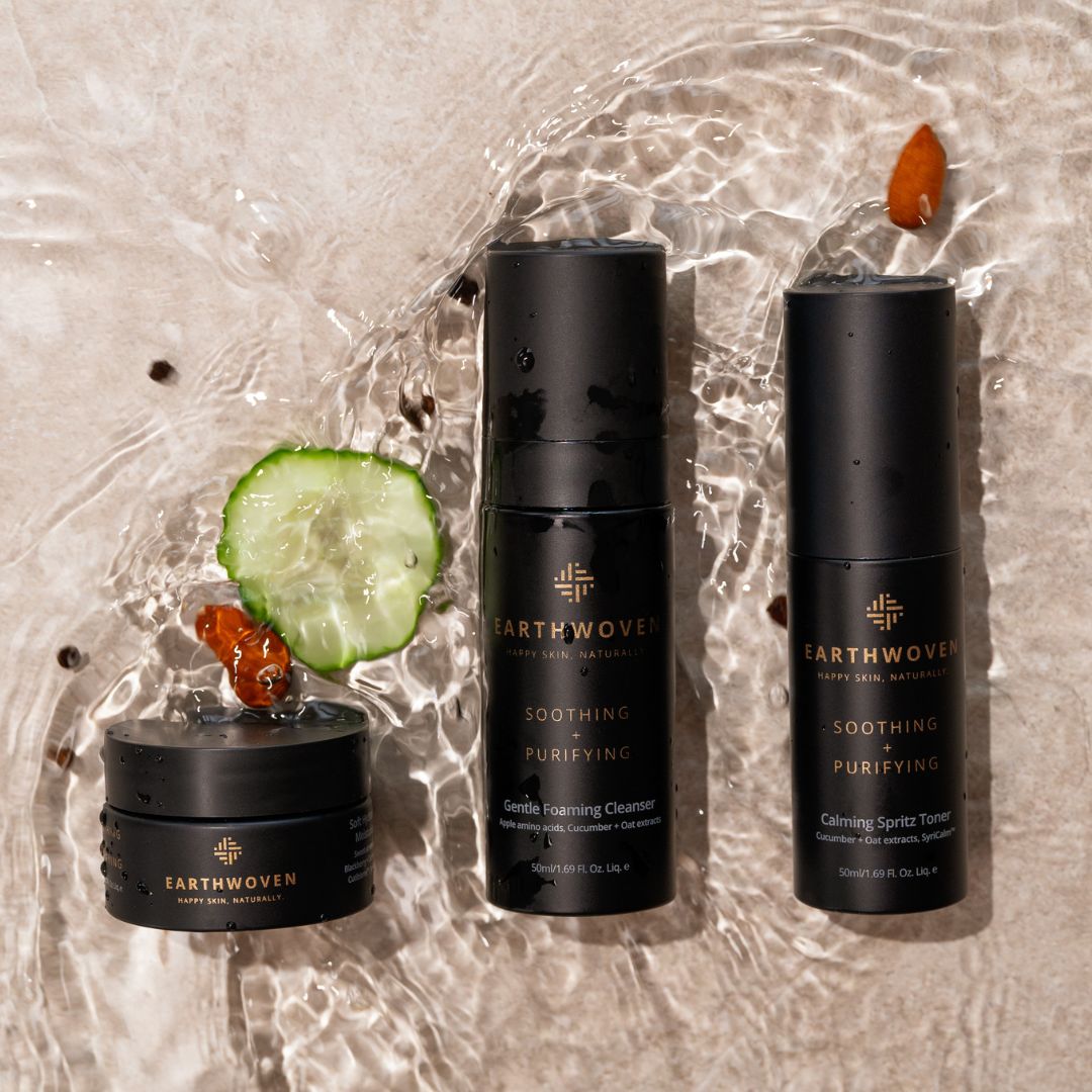 Earthwoven Trial Kit - Gentle Foaming Cleanser, Calming Spritz Toner, and Soft Hydrating Moisturiser displayed on a natural, water-textured background with cucumber and goji berry accents